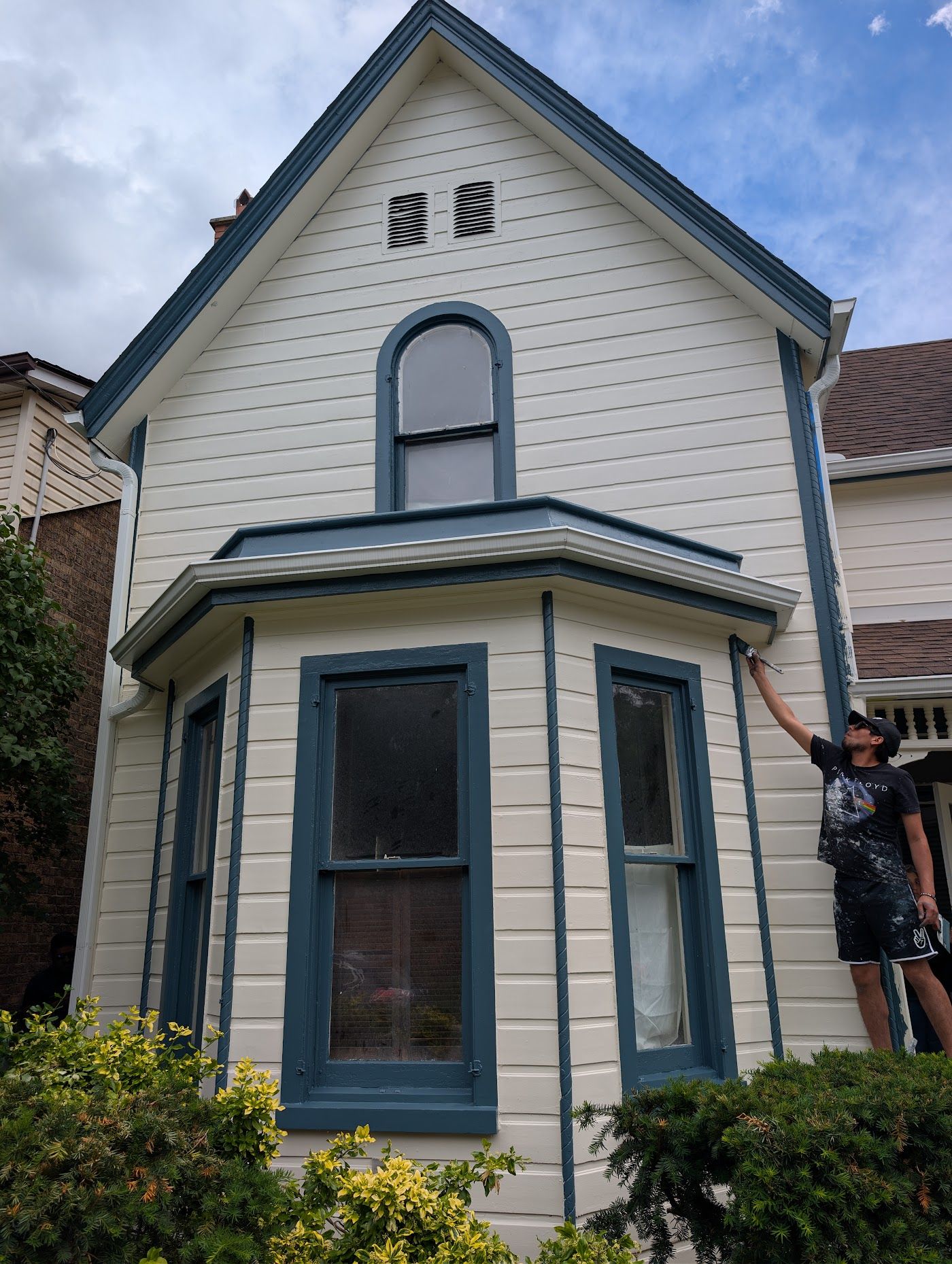 Crisp navy and cream trim on a repainted heritage bay window