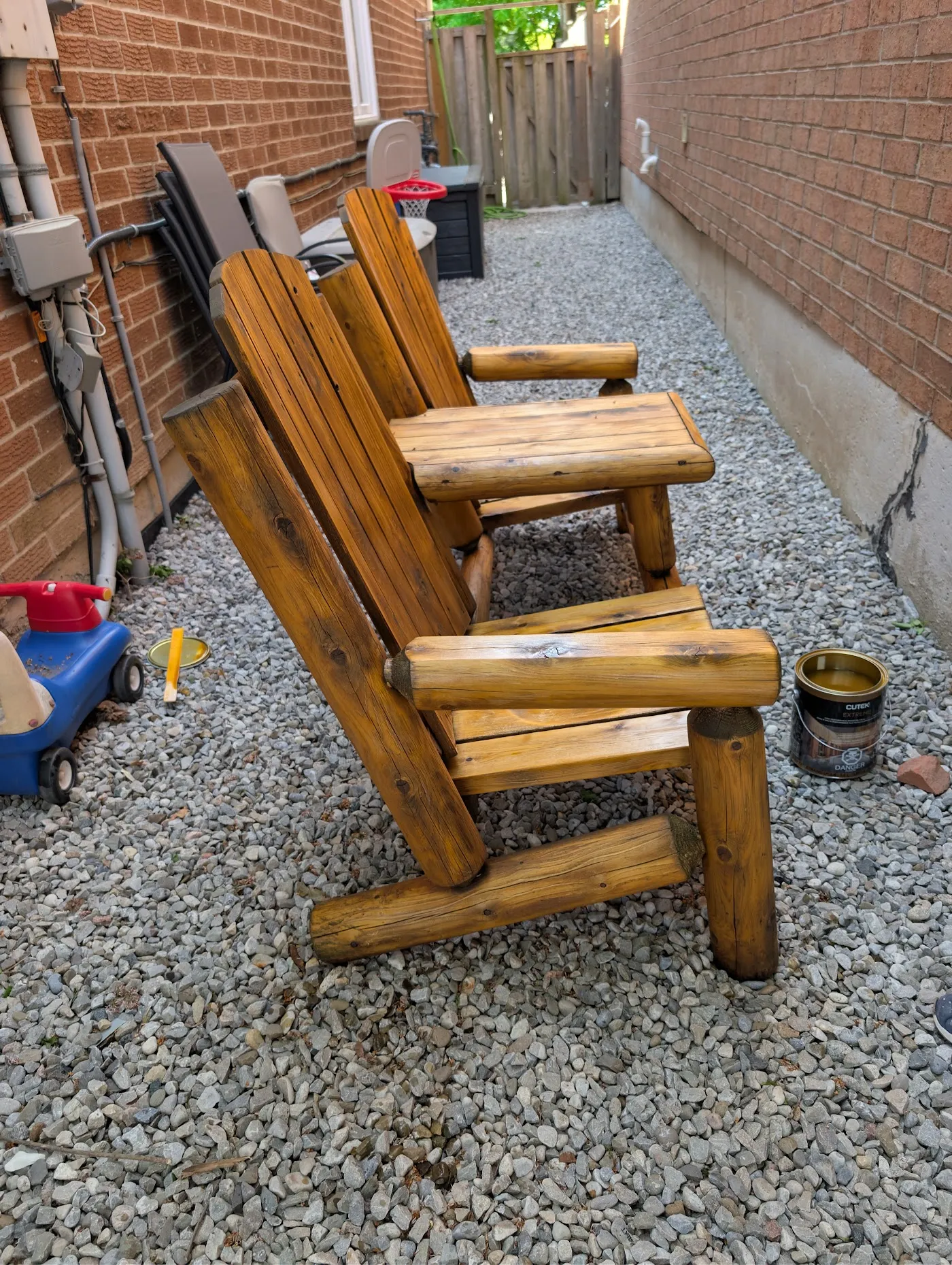 The same cedar chairs after stripping and re-staining